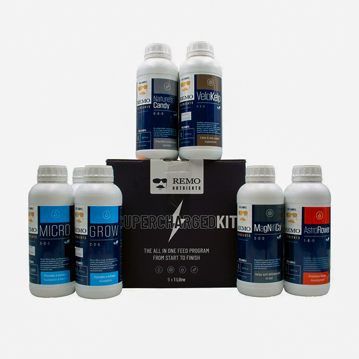 A set of various bottles of Remo brand plant nutrients arranged in front of a black box labeled 'SUPERCHARGED KIT'.